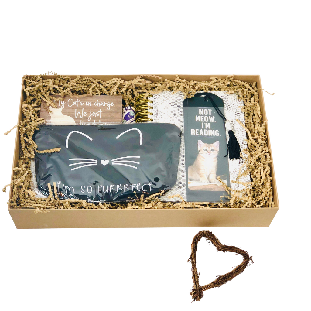 This cute gift box is a perfect gift to give to a cat lover as a birthday gift, thank you gift, or “just because”. Box includes a desk sign, journal, gold-black ink pen, makeup bag, adorable cat bookmark, journal, and lip balm. Gift comes with a handwritten note. Please send us the message that you would like to include.